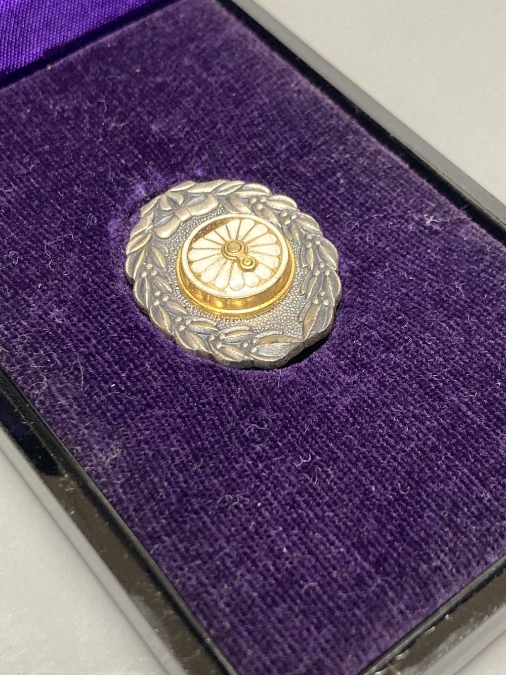 Two Japanese historic medals possibly silver and enamel